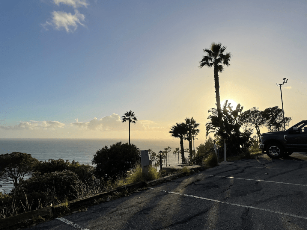 View of the ocean from Surf Outpost rv park and campground during sunset