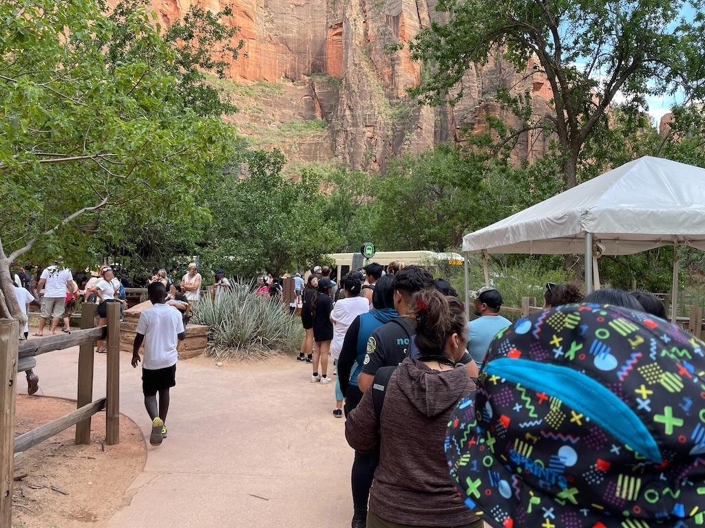 Long line at Zion National Park during the day to catch the bus back