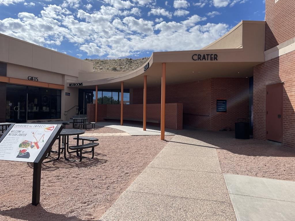 Meteor Crater Discovery Center with welcome sign at the entrance, showing a map of the attraction