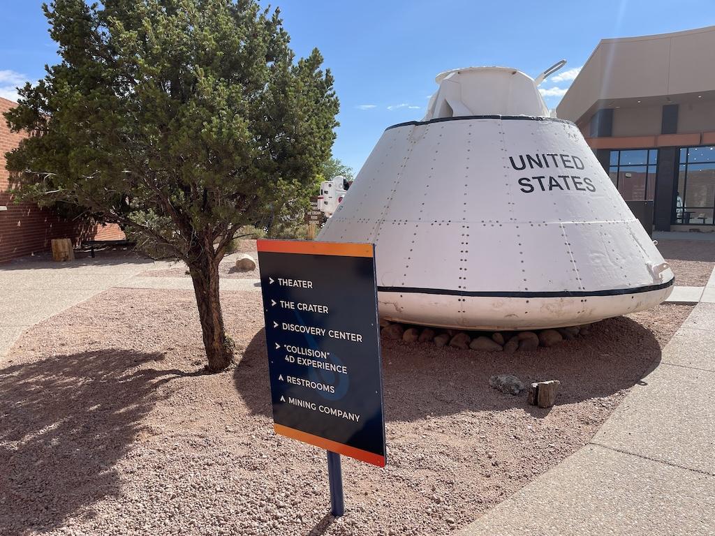 Test capsule that astronauts trained in at Meteor Crater with signage in front