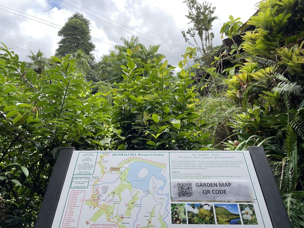 Map of Ho’omaluhia Botanical Garden with information about the garden in front of plants and trees