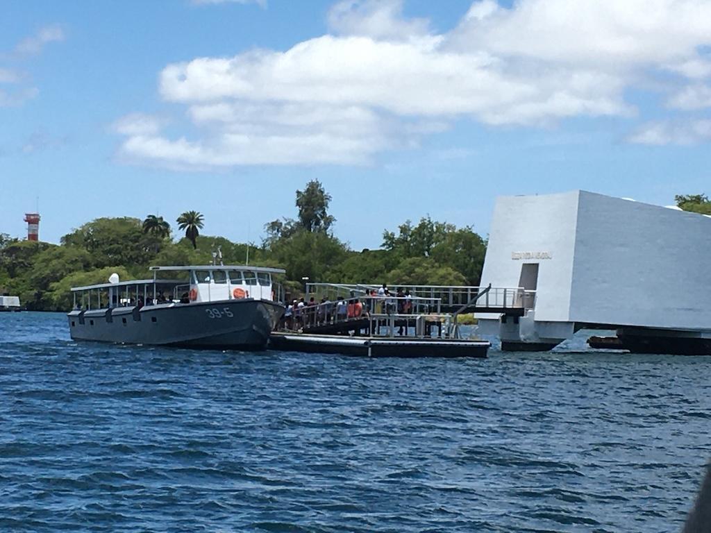 People boarding boat at the USS Arizona memorial at Pearl Harbor on Oahu, Hawaii