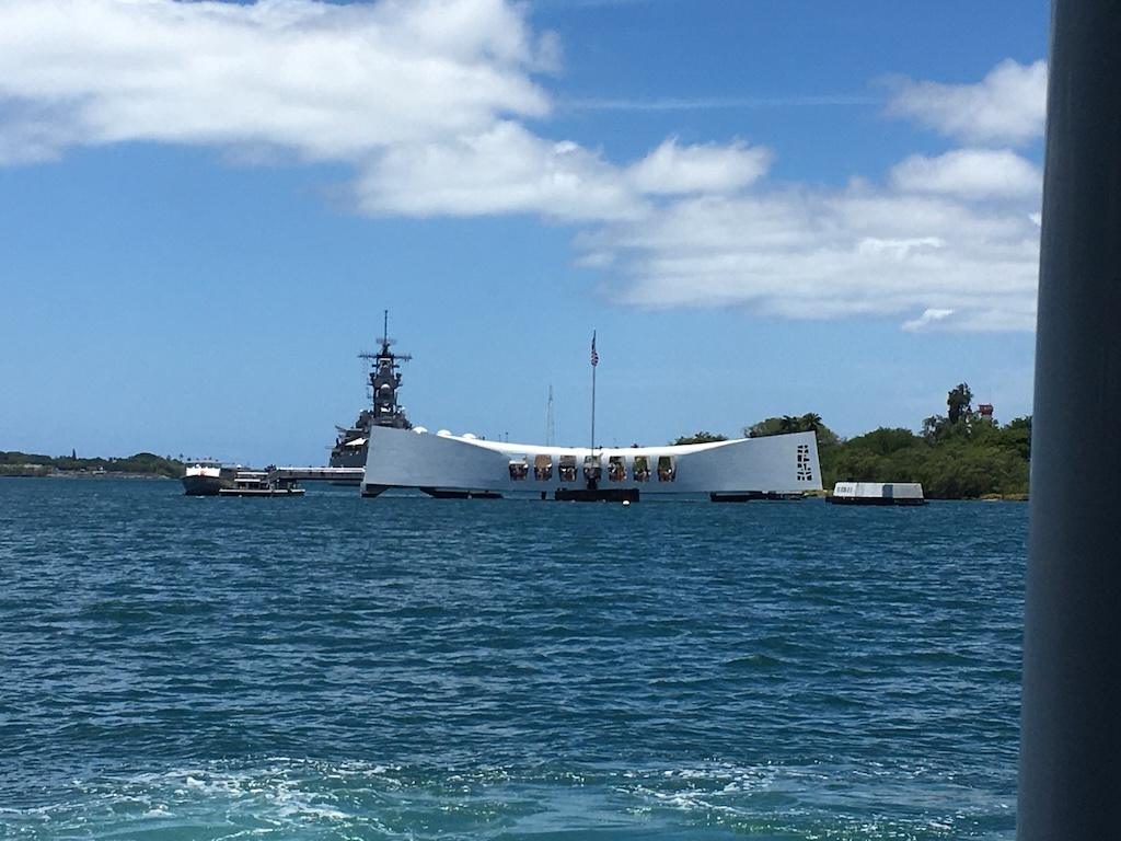 Distance view of the USS Arizona memorial at Pearl Harbor in Oahu, Hawaii