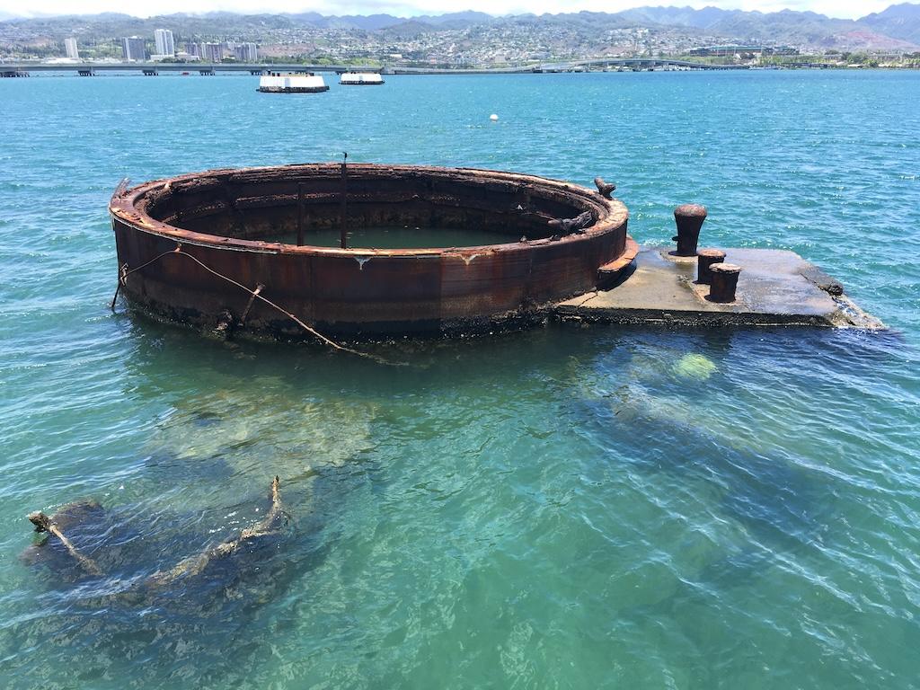 Part of USS Arizona sticking out of the water at Pearl Harbor National Memorial in Oahu, Hawaii