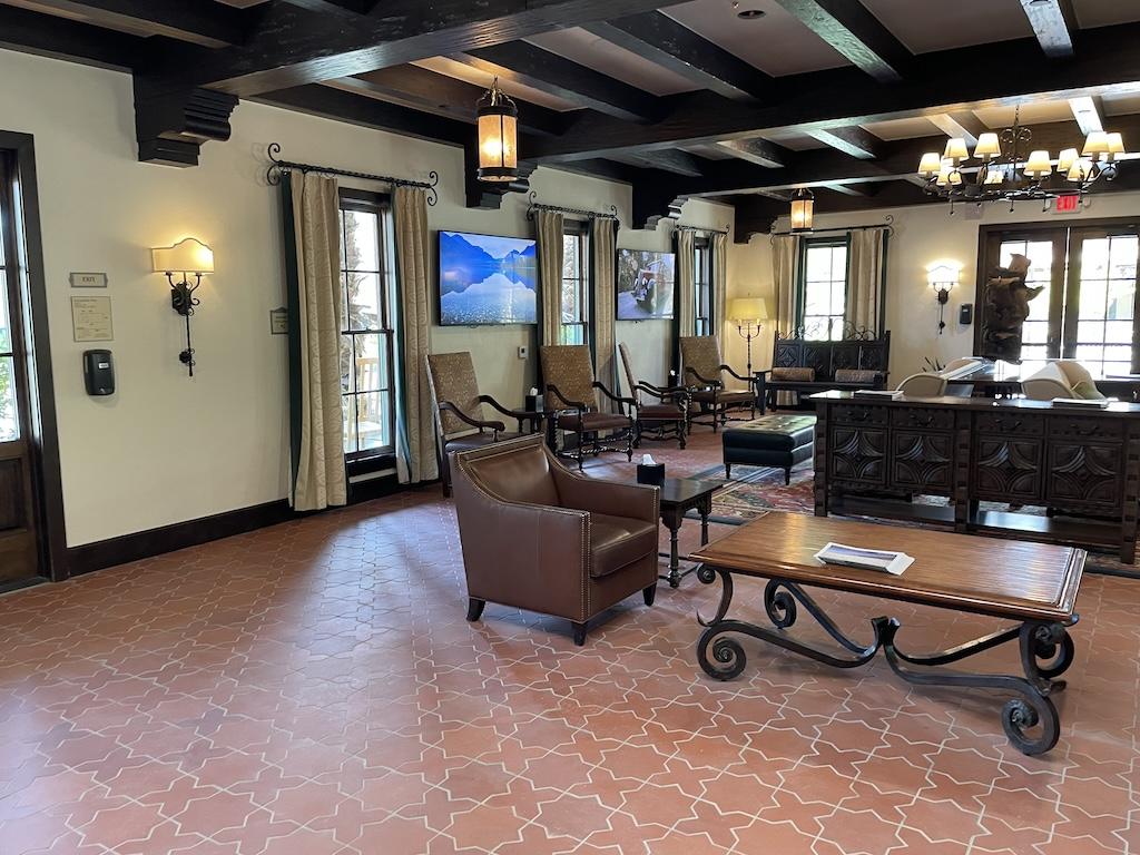 The Ranch at Death Valley lobby where people check in, furnished with old western themed furniture and decorations