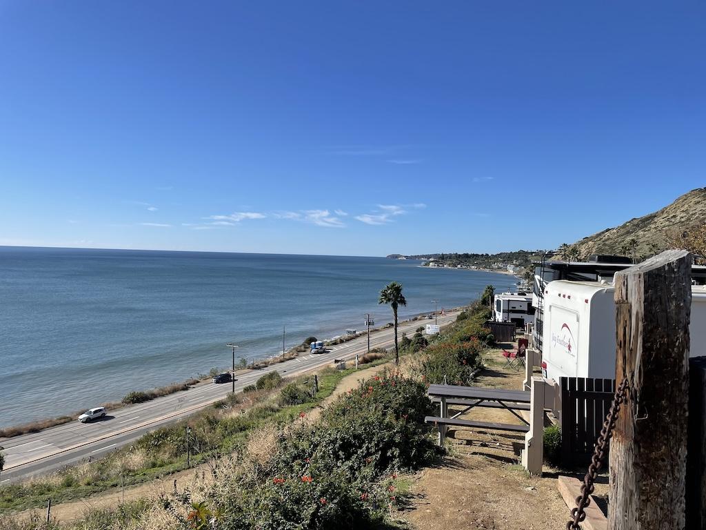 Ocean view of Pacific Ocean and PCH next to Surf Outpost in Malibu, California.