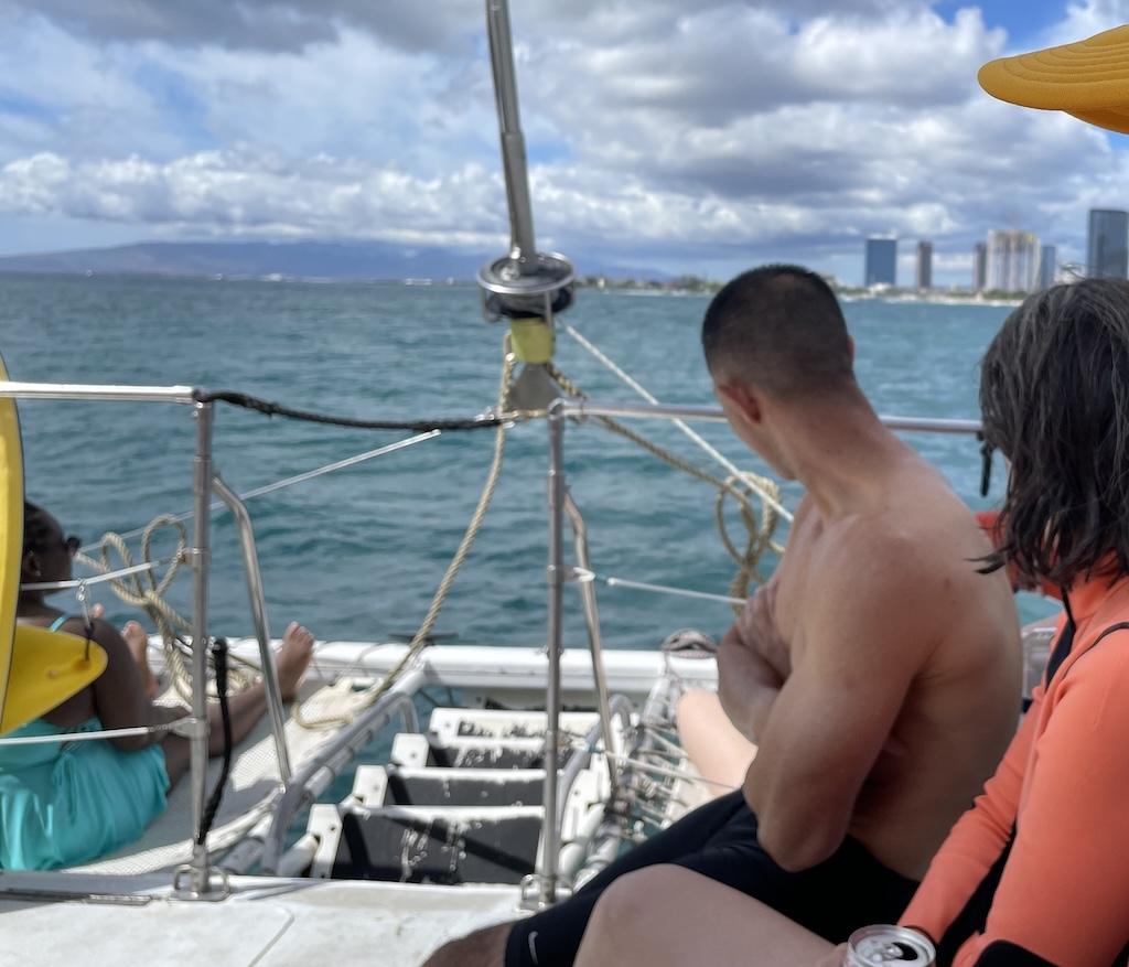 Passengers riding Oahu Catamarans on the Pacific Ocean in Hawaii.