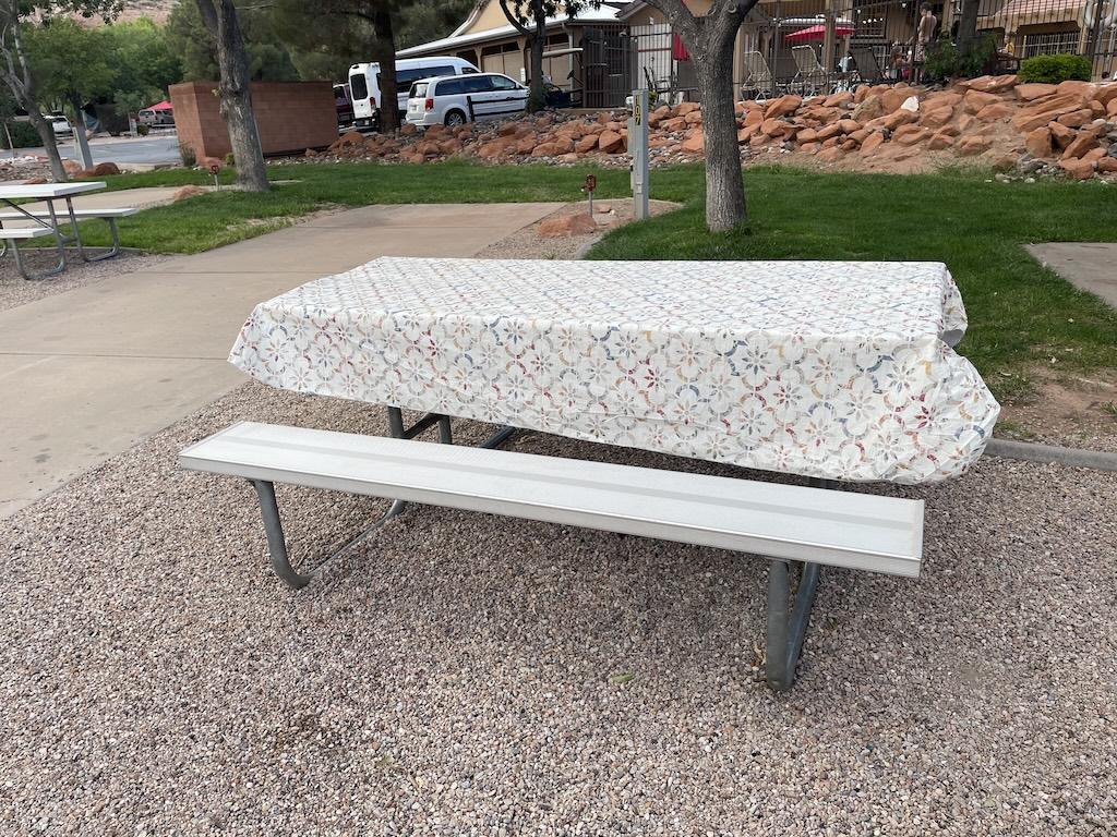 Picnic table with table cloth at Luna’s parking spot at Zion River Resort RV Park and Campground in Virgin, Utah