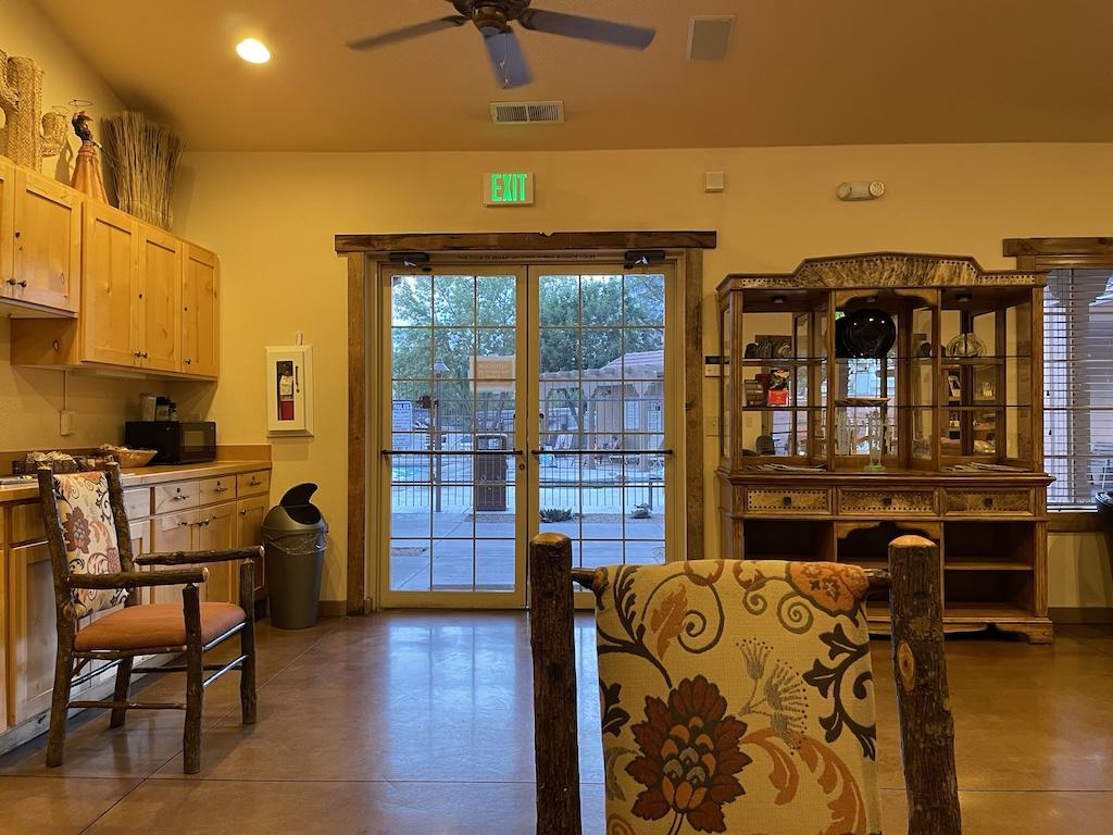 View of social hall with kitchen and pool in the distance at Zion River Resort RV Park and Campground in Virgin, Utah