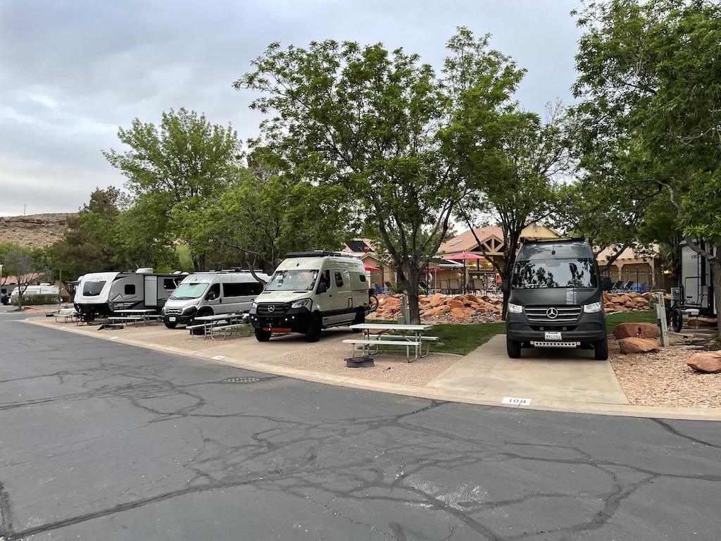 Luna’s camper van next to other ones parked at Zion River Resort in Utah