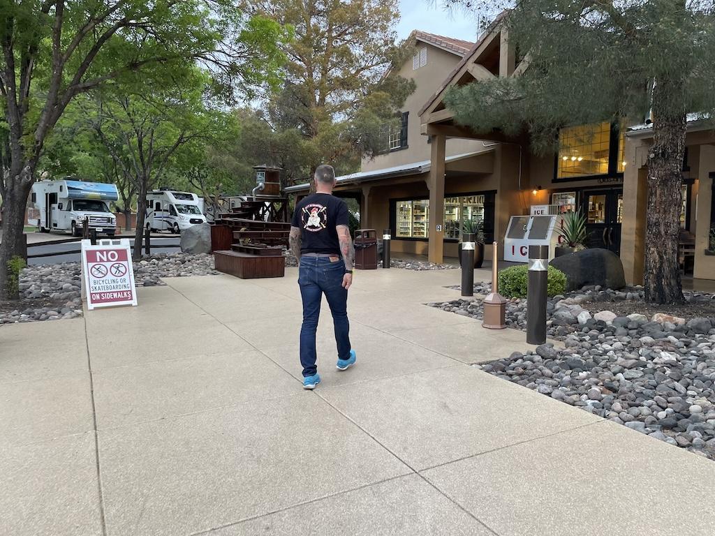 Man walking up to Zion River Resort to check in at the office in Utah