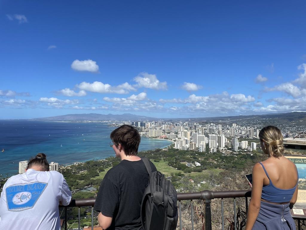 People looking at the view of Waikiki and the Pacific Ocean from the summit of Diamond Head Crater