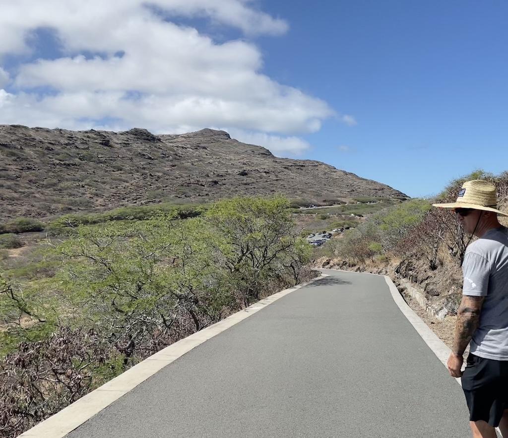 Man walking on the trail on the Makapu’u Lighthouse hike in Oahu, Hawaii