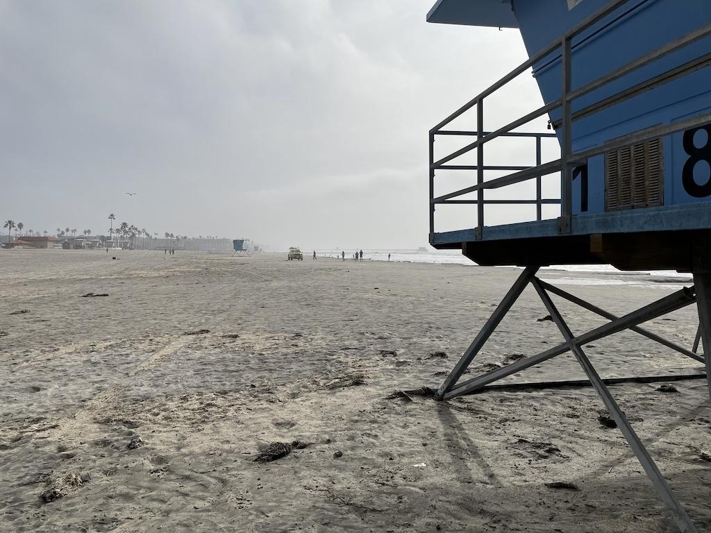 View of people at the beach at Oceanside Harbor, California