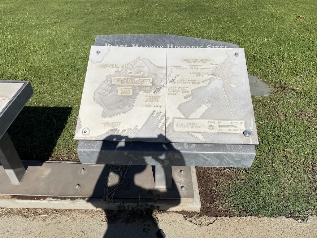 Luna’s shadow over the braille map she saw at Pearl Harbor National Monument in Oahu, Hawaii