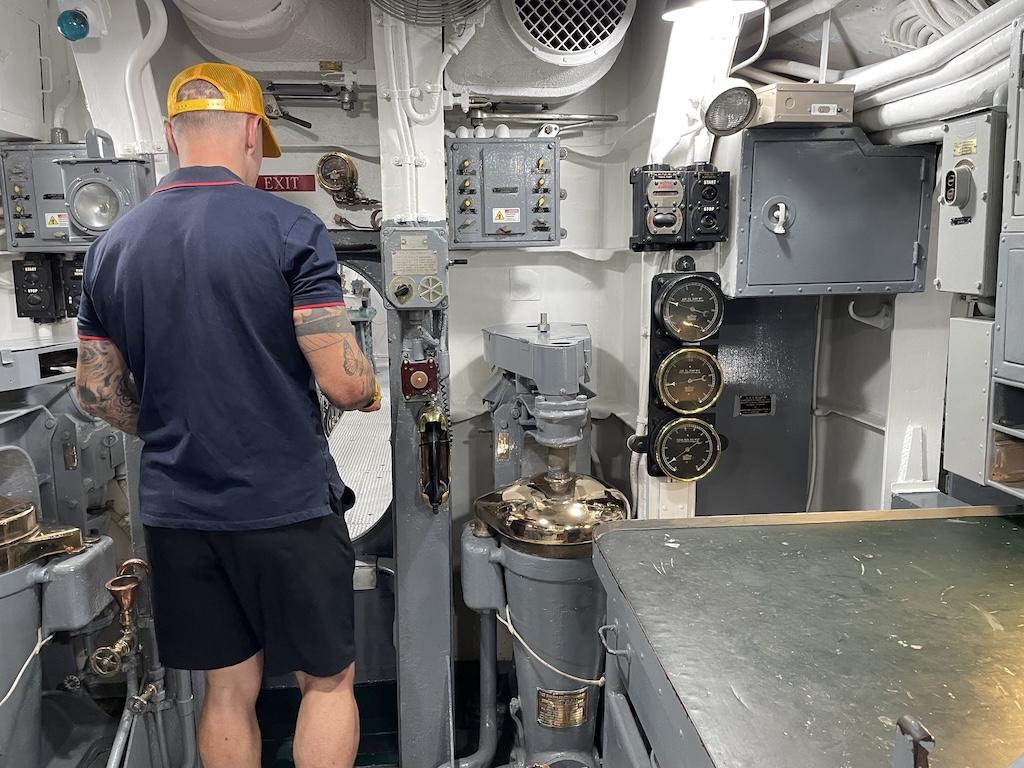 Man about to enter door on the USS Bowfin at Pearl Harbor in Oahu, Hawaii
