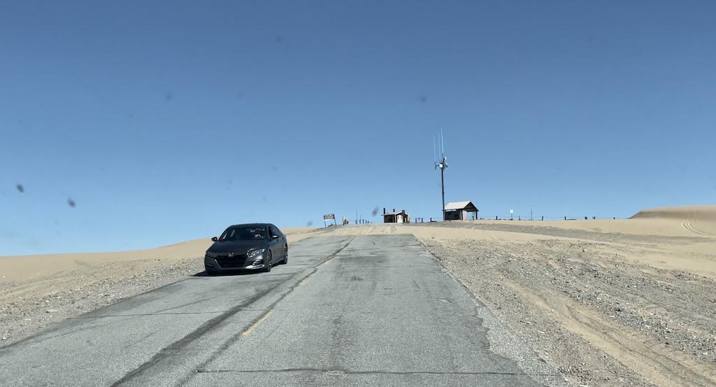View from Luna’s camper van traveling up the road to Hugh T. Osborne Lookout Park at Glamis Sand Dunes