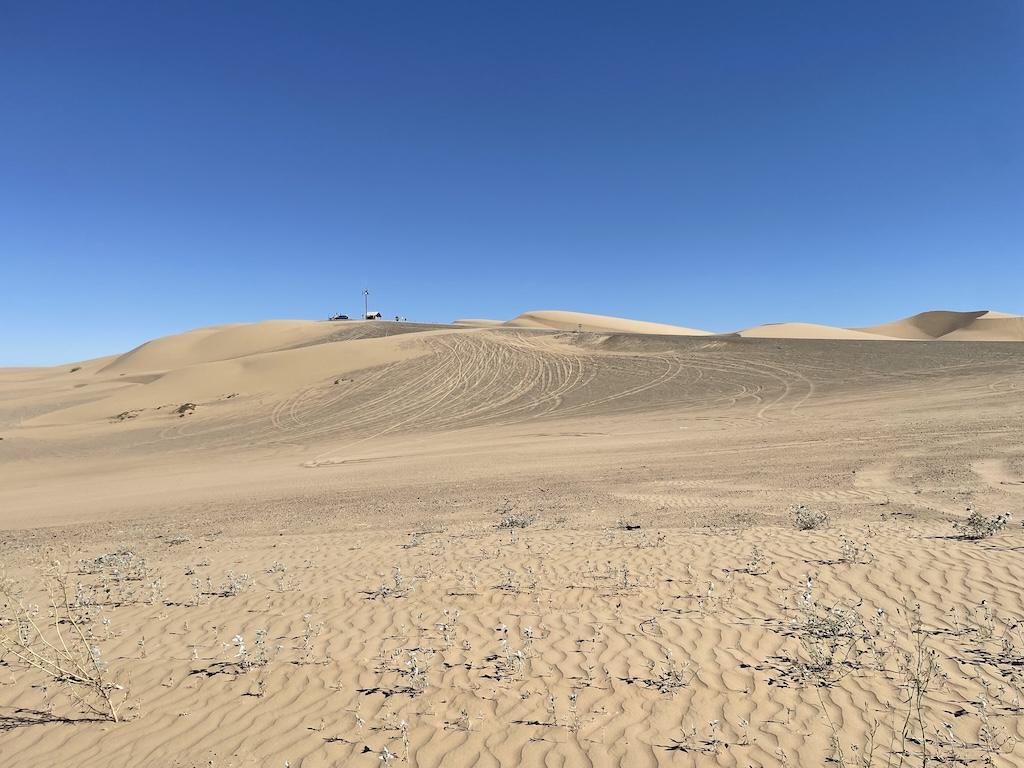 Distance view of off-road tracks in the sand at Glamis Sand Dunes, in California