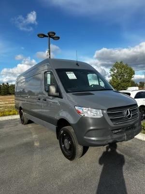 View of Luna’s Mercedes sprinter van in the parking lot of the dealership in which they bought it at used