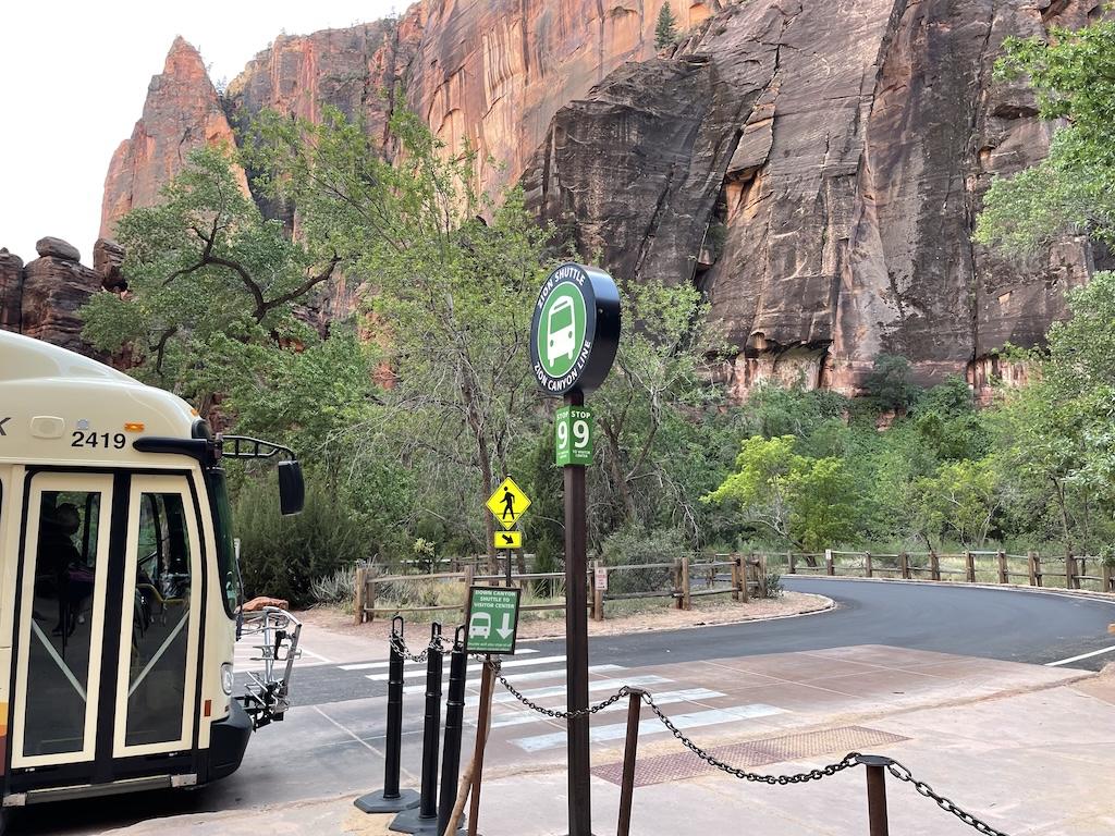 Bus pulling up to bus stop 9 for the Riverside Walk and the Narrows at Zion National Park in Utah
