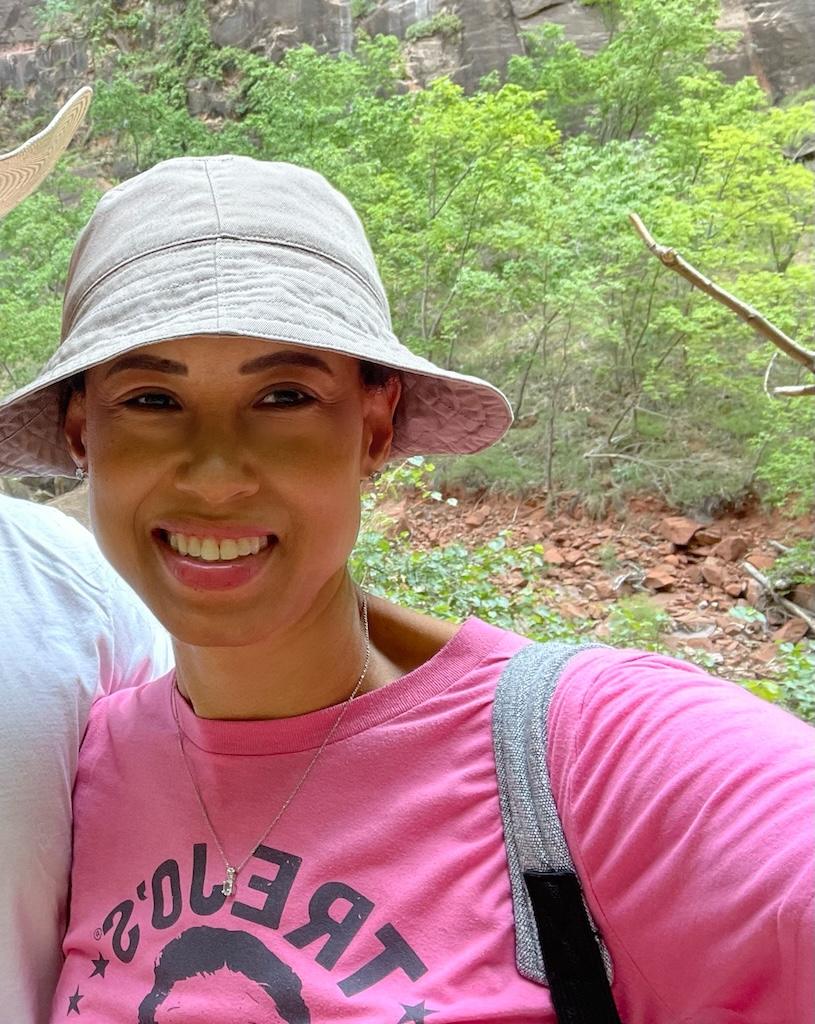 Close up of Luna smiling to the camera on the Riverside Walk at Zion National Park in Utah