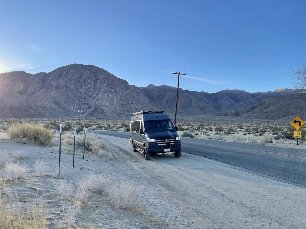 Luna’s Sprinter van on the side of Borrego Springs Road at Galleta Meadows in Anza-Borrego, California