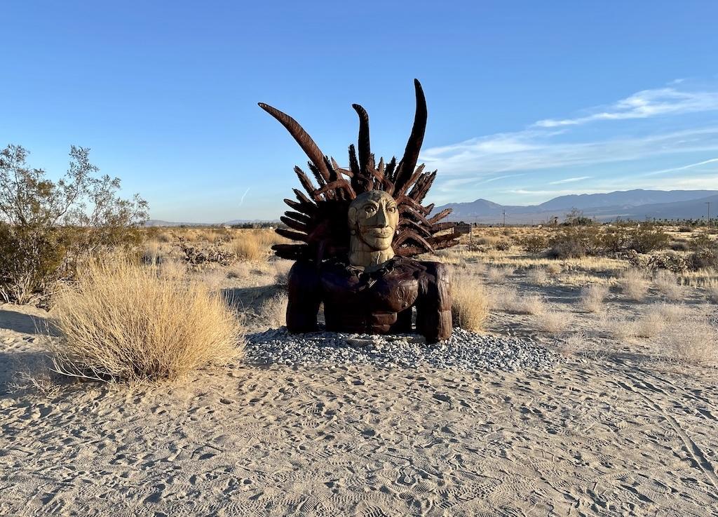 Close up of warrior head sculpture with headdress at Galleta Meadows in Anza-Borrego, California