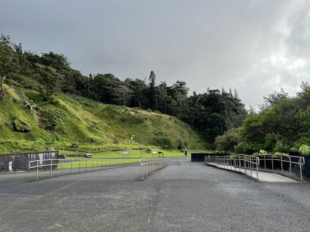 View of man in far distance at the at Nu’uanu Pali Lookout, in Oahu, Hawaii 