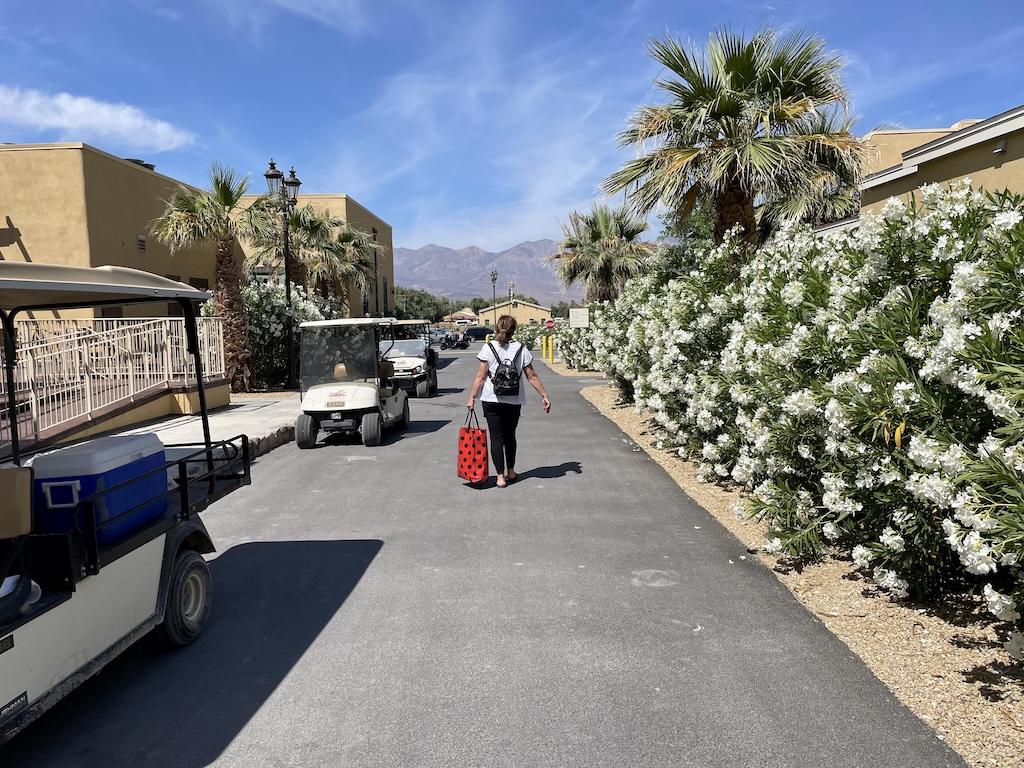 Woman walking down the path to the cottage at the Ranch at Death Valley Oasis in California