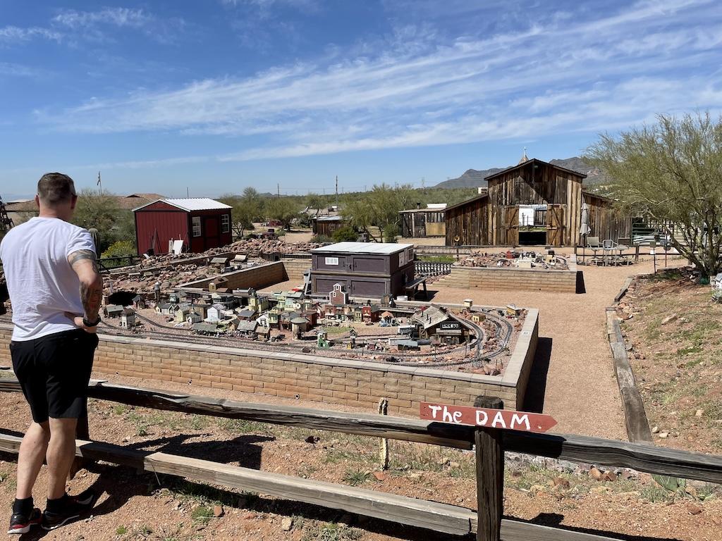 Man looking at the Superstition Mountain Museum Railroad in Apache Junction, Arizona