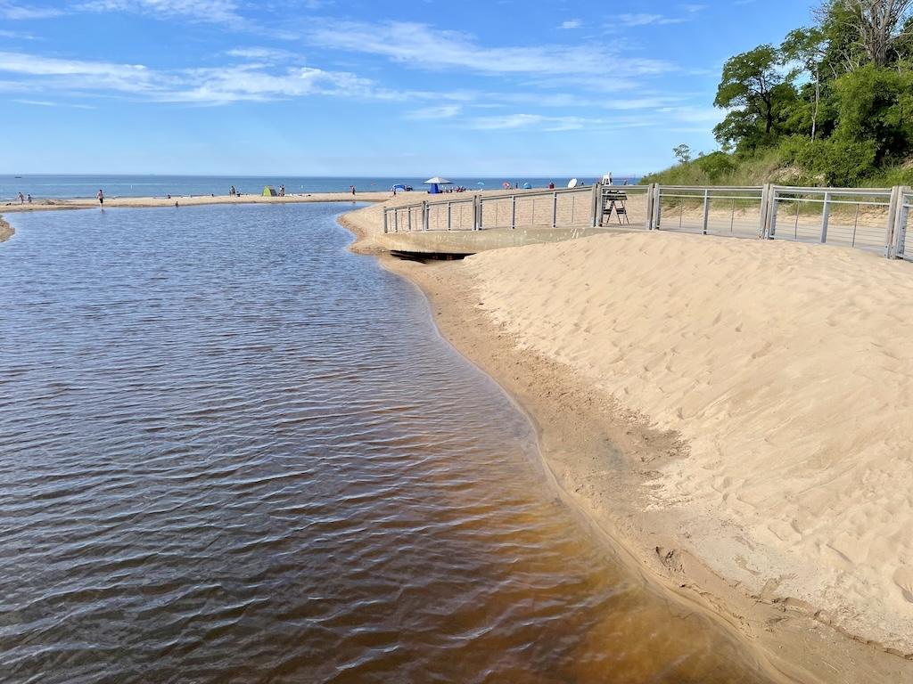 View of water and people at the beach in distance at Indiana Dunes State Park