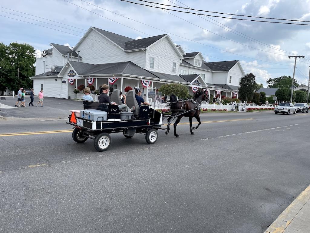 View of Amish people riding in a horse-drawn buggy in Shipshewana, Indiana