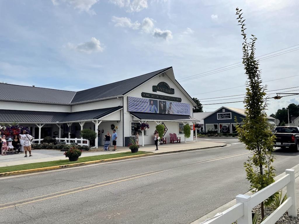 View of people walking around outside of a store in Shipshewana, Indiana