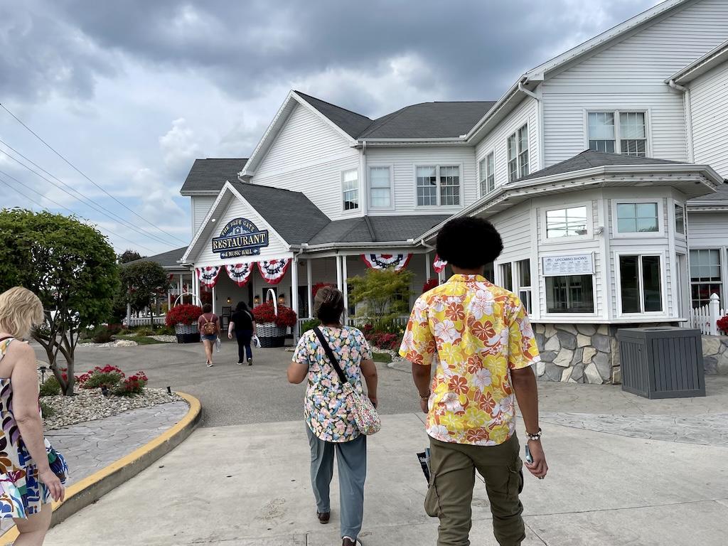 People walking to the Blue Gate Restaurant in Shipshewana, Indiana 