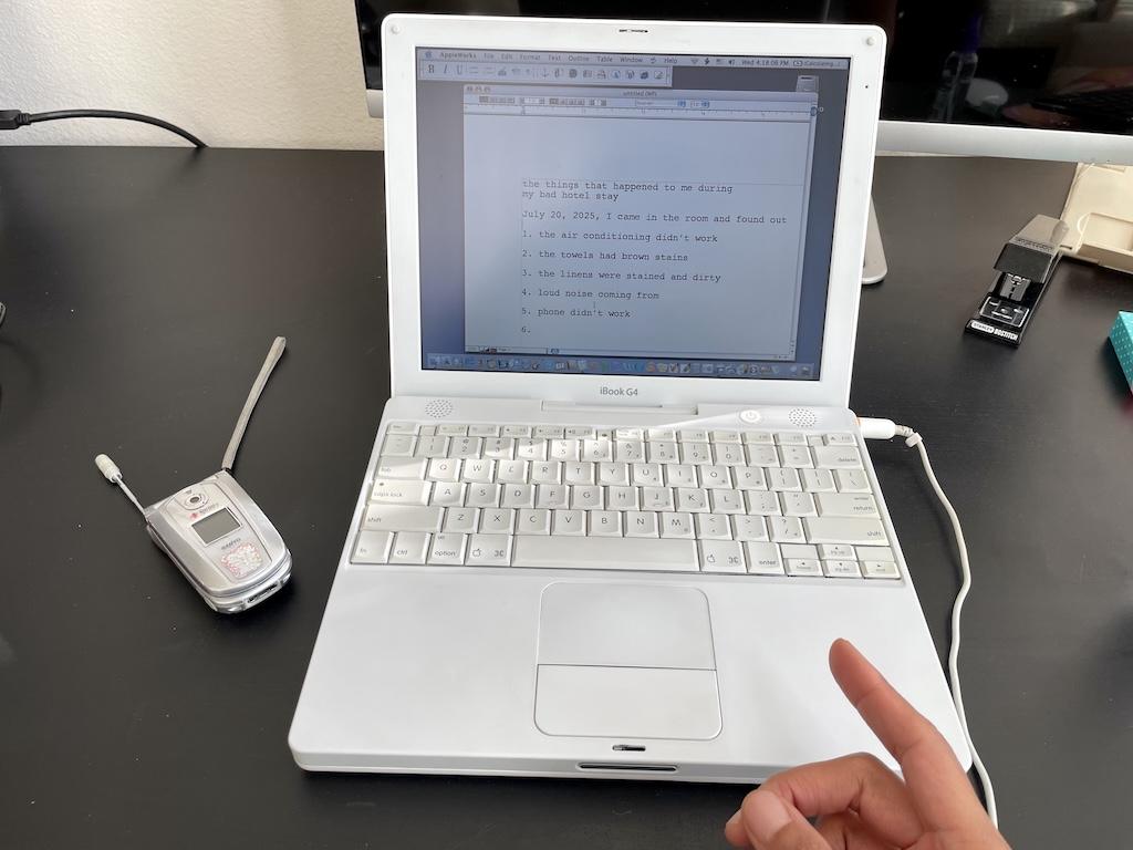 View of Luna’s old iBook G4 Apple laptop in her office