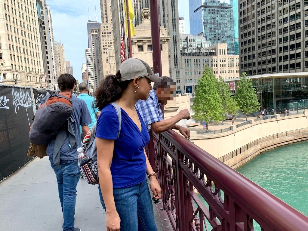 Luna looking down at the Chicago River with a view of buildings in the background in Illinois