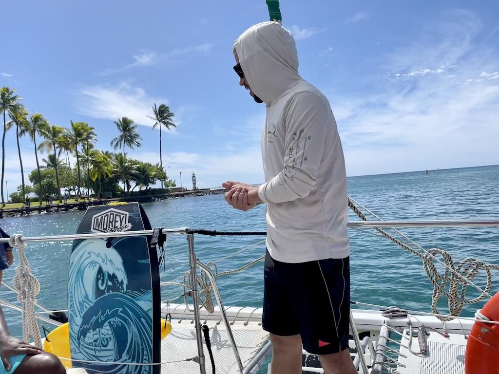 View of tour guide explaining safetly on catamaran on Oahu Catamarans, Hawaii