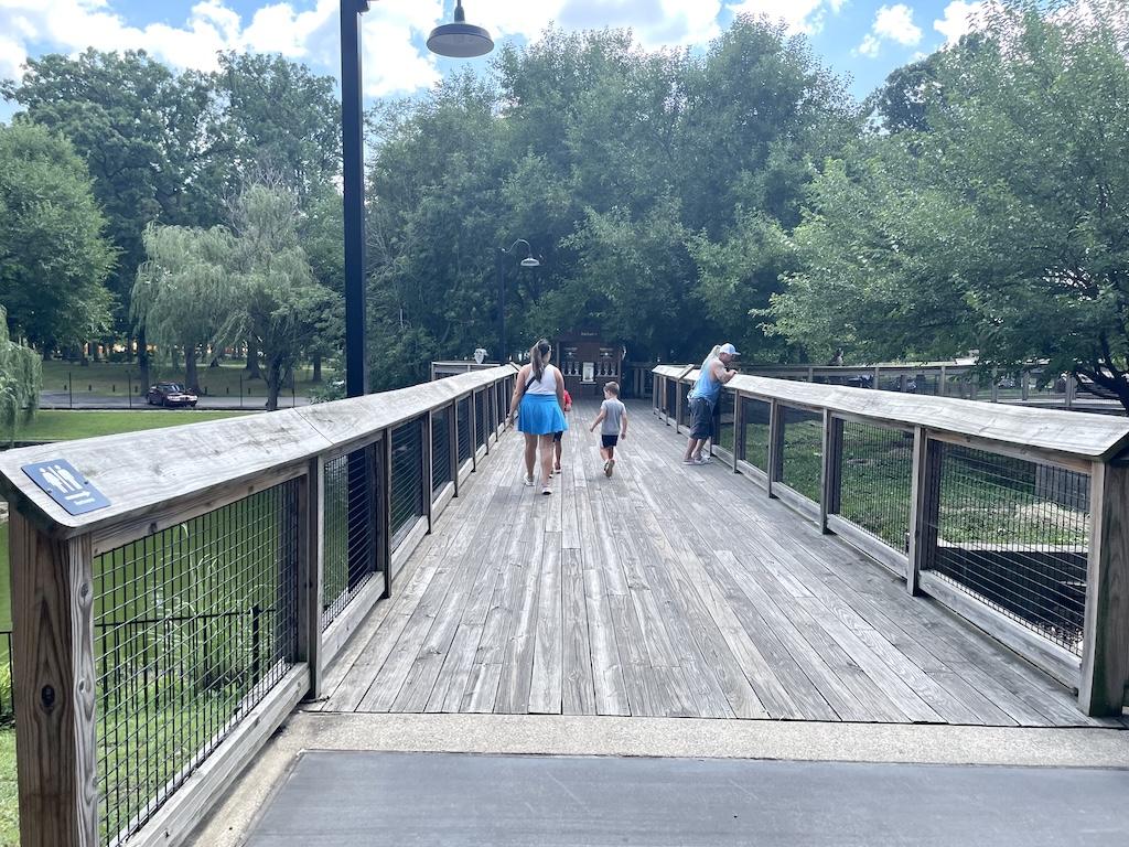 People walking on the bridge at Potawatomi Zoo in Indiana