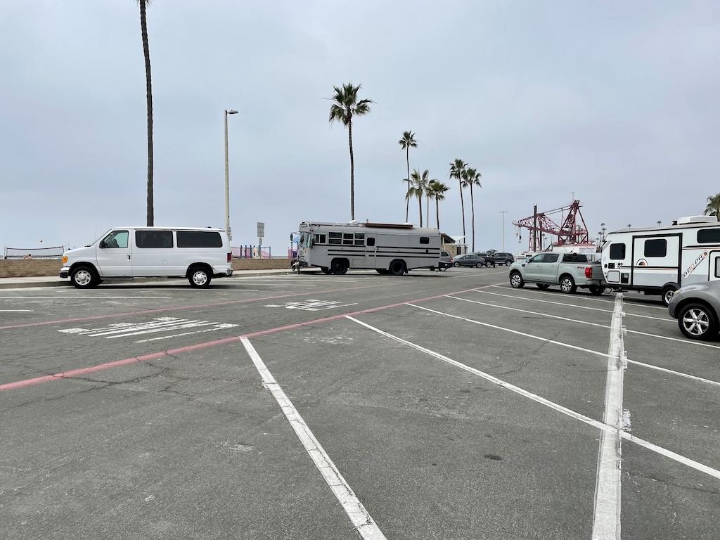 Vehicles parking in the overnight parking lot in Oceanside Harbor, California