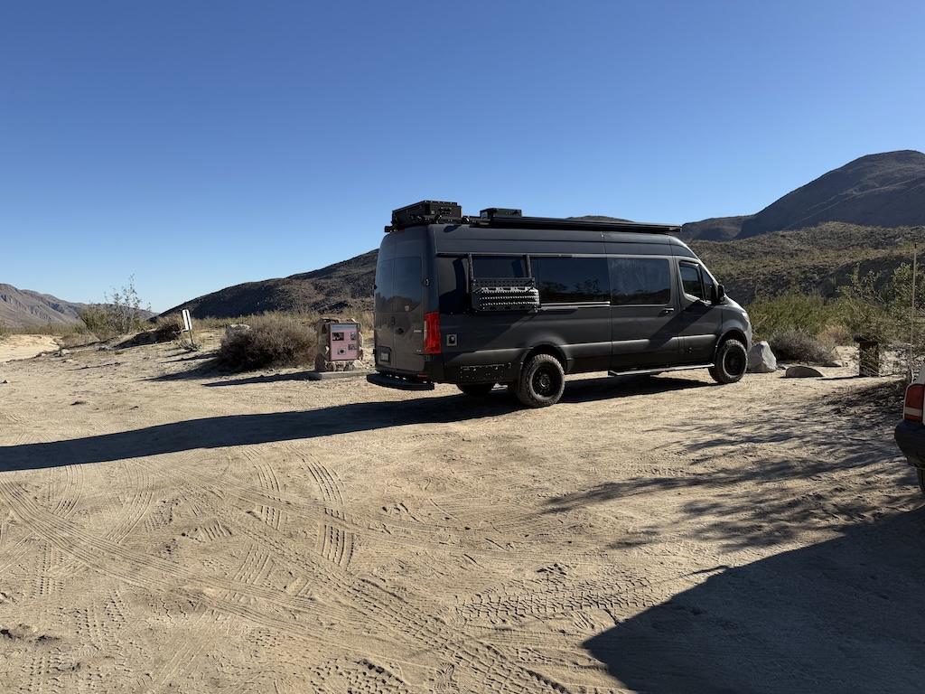 View of Luna’s Sprinter van parked in the lot at Lower Coyote Canyon, at Anza-Borrego Desert State Park, California.
