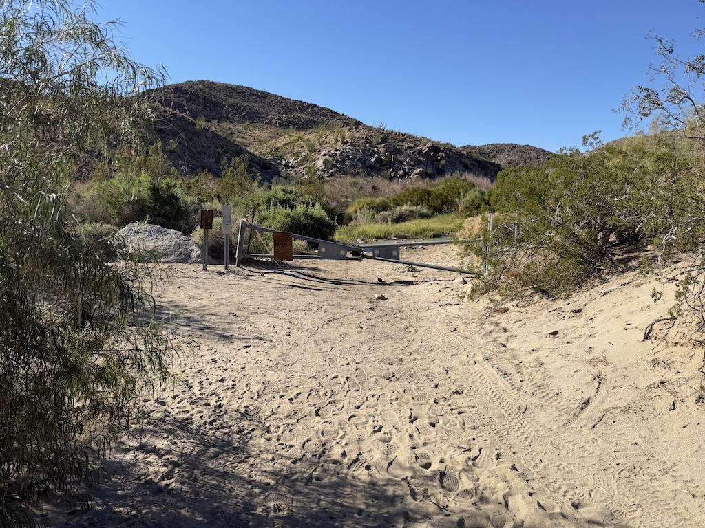 View of gate pulled over the road at Lower Coyote Canyon, at Anza-Borrego Desert State Park, California.