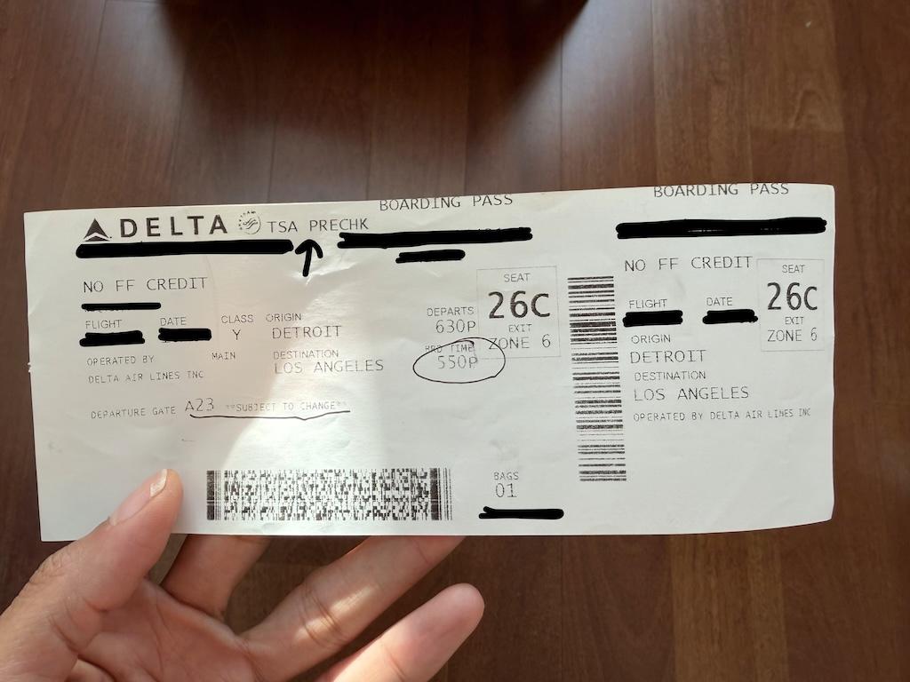 Delta boarding pass from a flight Luna took with TSA Precheck printed on top of ticket