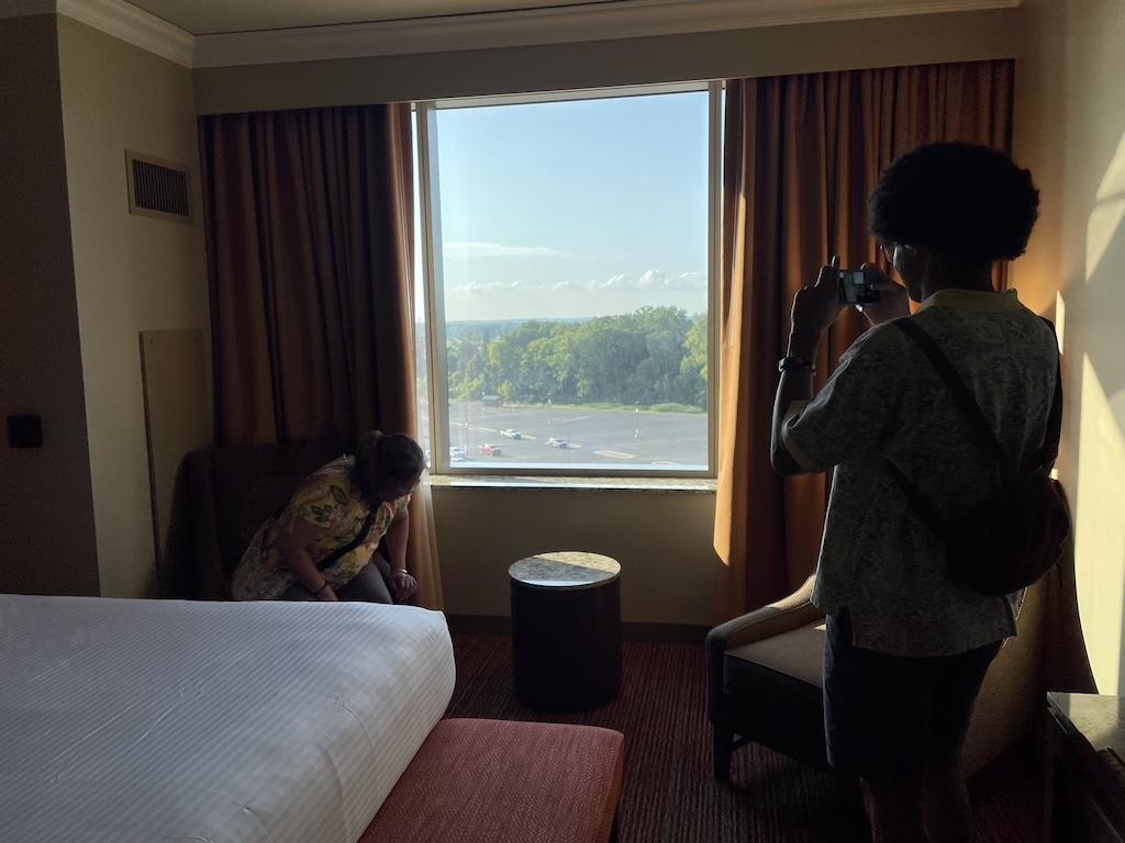 Window view in Standard Room at Four Winds Casino South Bend, Indiana showing man taking picture