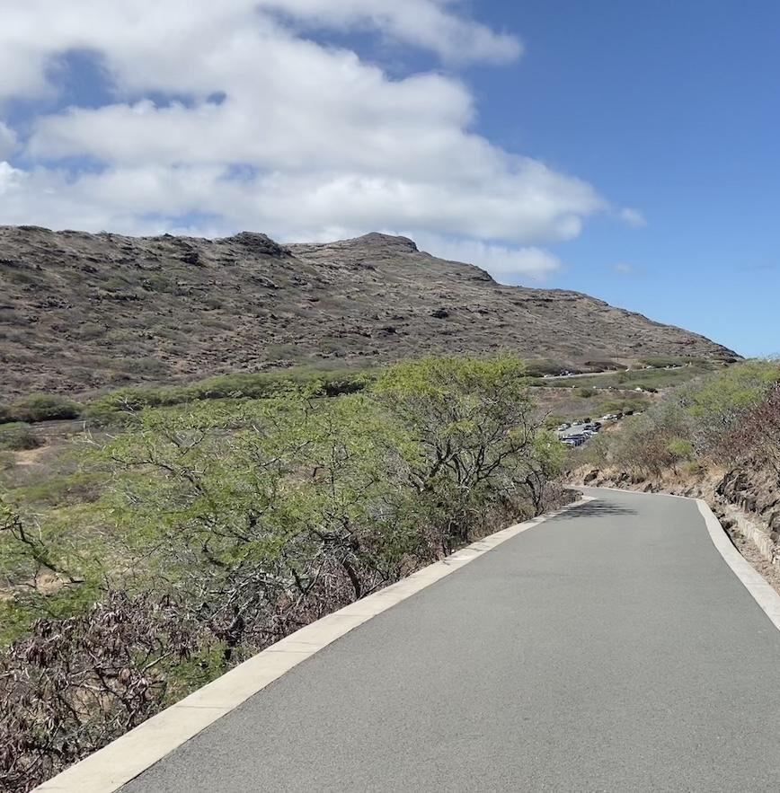 Man walking on the trail on the Makapu’u Lighthouse hike in Oahu, Hawaii