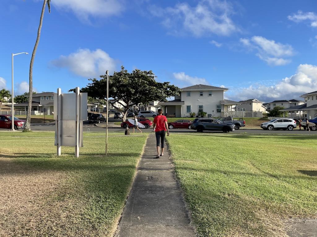 Lady walking on sidewalk at Marine Corps Base Hawaii, North Beach, Oahu
