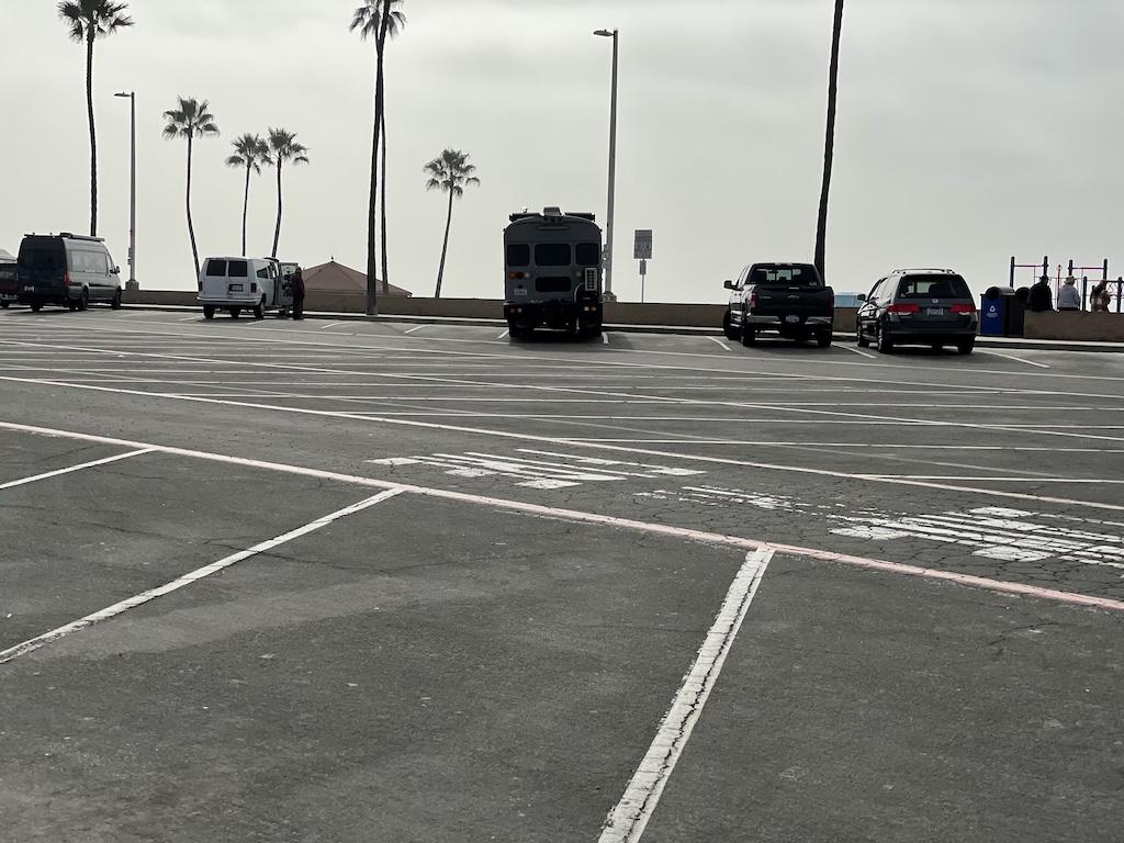 Vehicles parked in overnight lot at Oceanside Harbor, California, where Luna went van camping