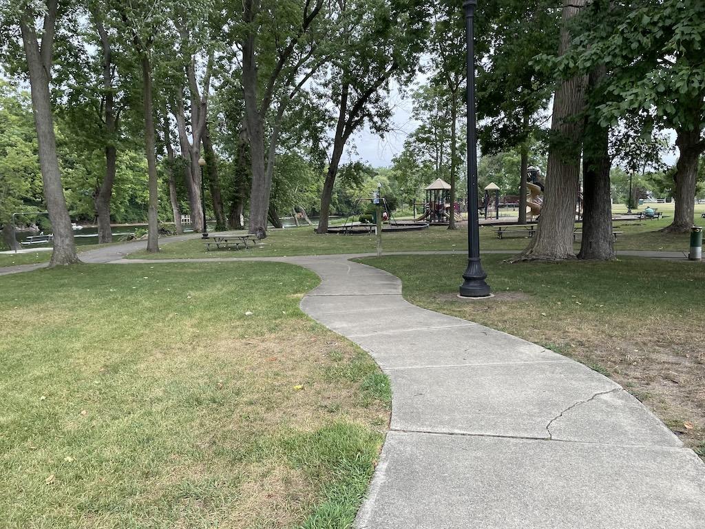 View of playground in distance at Riverfront Park in Niles, Michigan